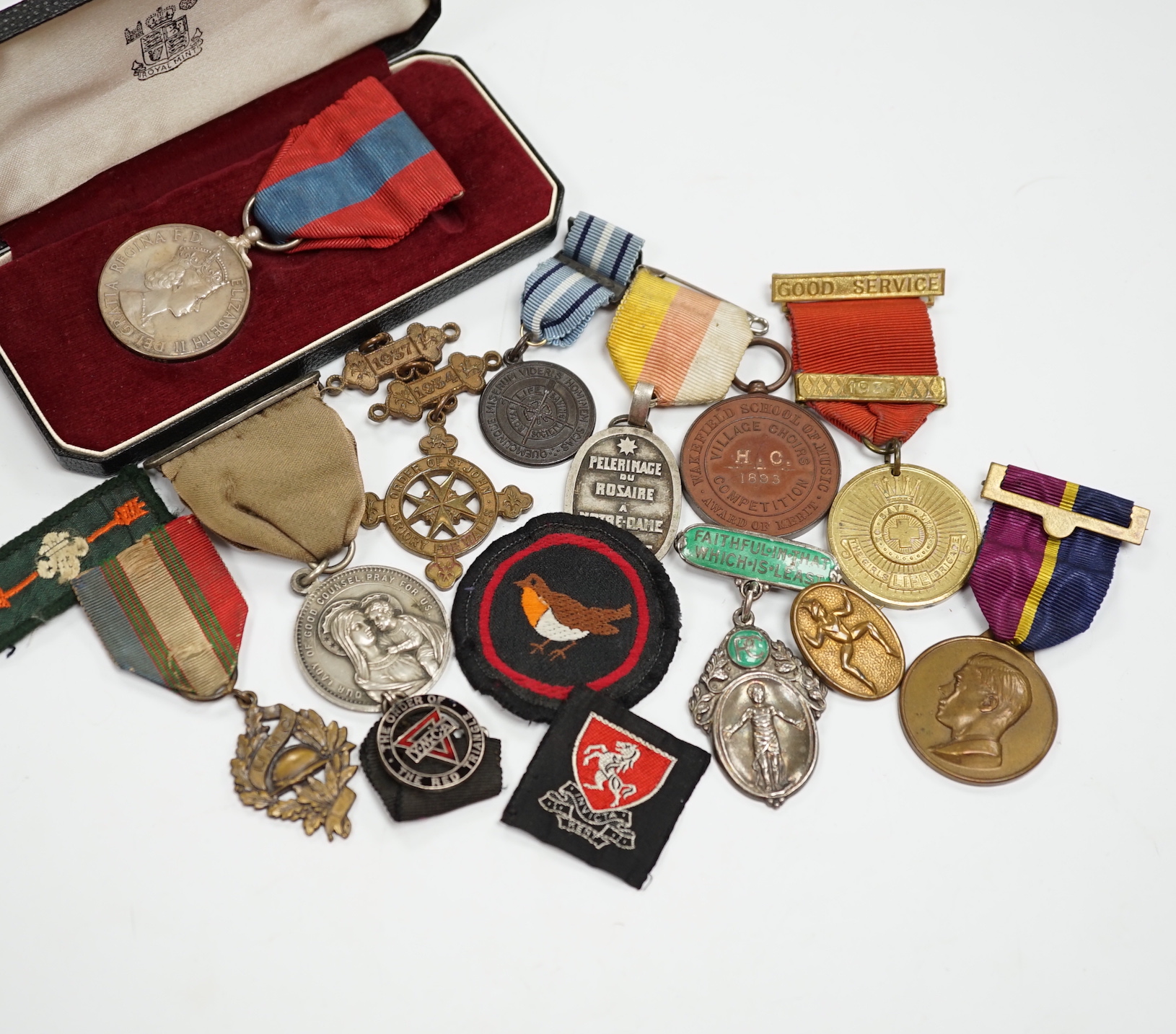 A collection of medals and badges, including eight Special Constabulary Service Medals, Fire Service Medal, a cased Police Long Service and Good Conduct Medal, masonic awards, including hallmarked silver gilt 1897 Diamon